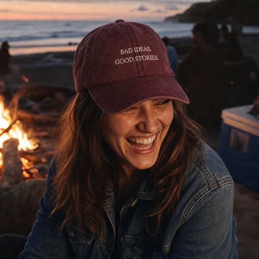 Bad Ideas. Good Stories. embroidered vintage cap in maroon, worn at a beach fire