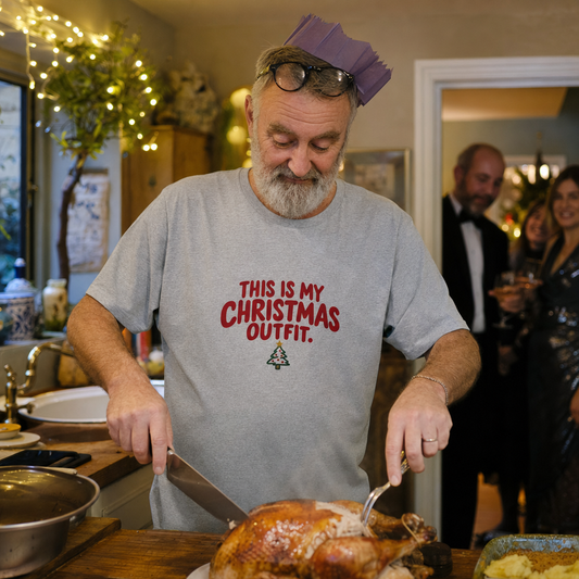 This Is My Christmas Outfit tee worn while carving the Christmas turkey